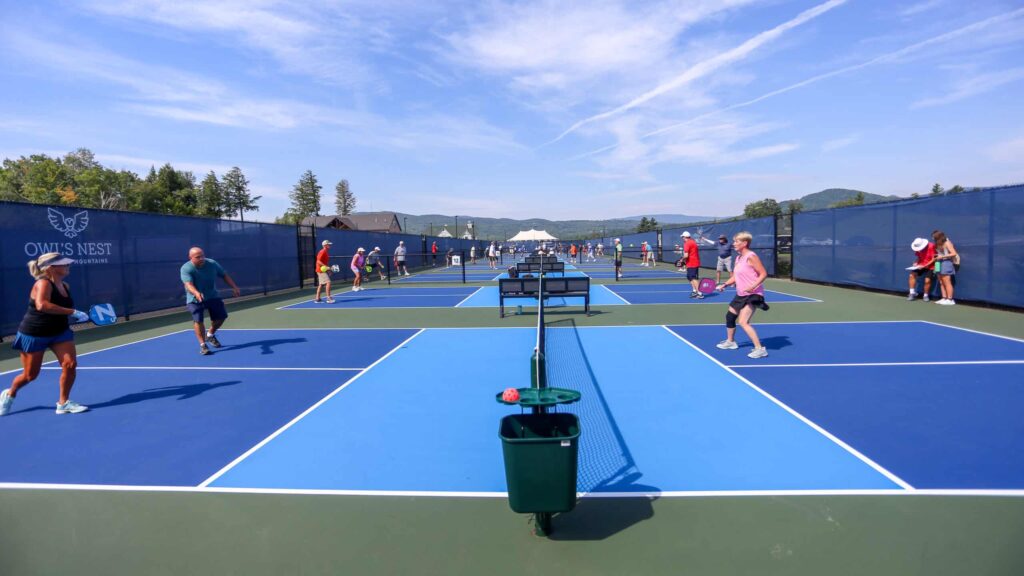 groups of people playing pickleball at Owls Nest Golf Resort in New Hampshire