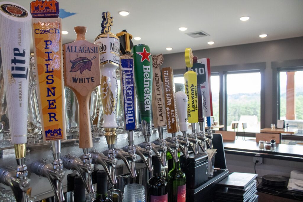 close-up-view-of-beer-taps-at-slice-pizzeria-bar-owl's-nest-resort